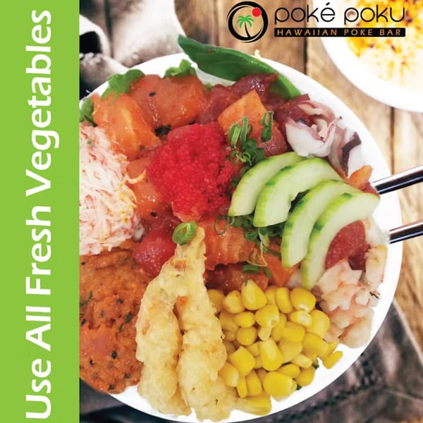 A colorful Poke Poku poke bowl filled with various fresh ingredients, including seafood, corn, and cucumber.