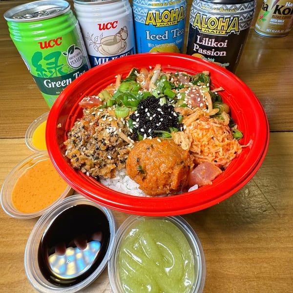 A vibrant Poke Poku bowl with various toppings, surrounded by four dipping sauces and four canned drinks.
