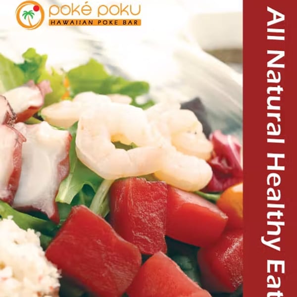 Close-up of a vibrant Poke Poku bowl with tuna, shrimp, octopus, and greens.